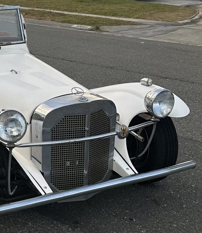 Classic convertible on a residential street, representing auto insurance coverage