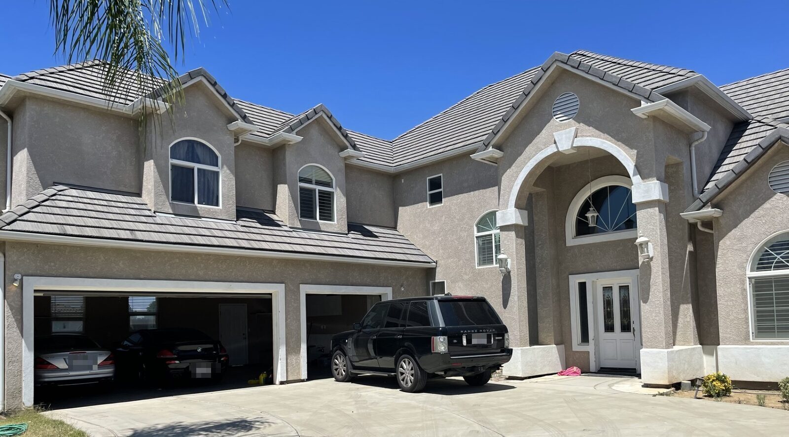 Large California home with a three car garage, representing homeowners insurance coverage